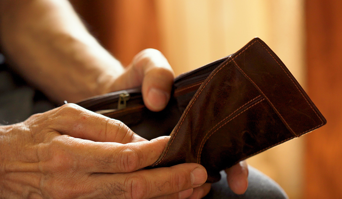 man opening empty wallet