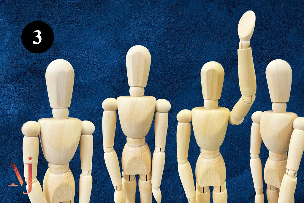 row of wooden mannequin figures