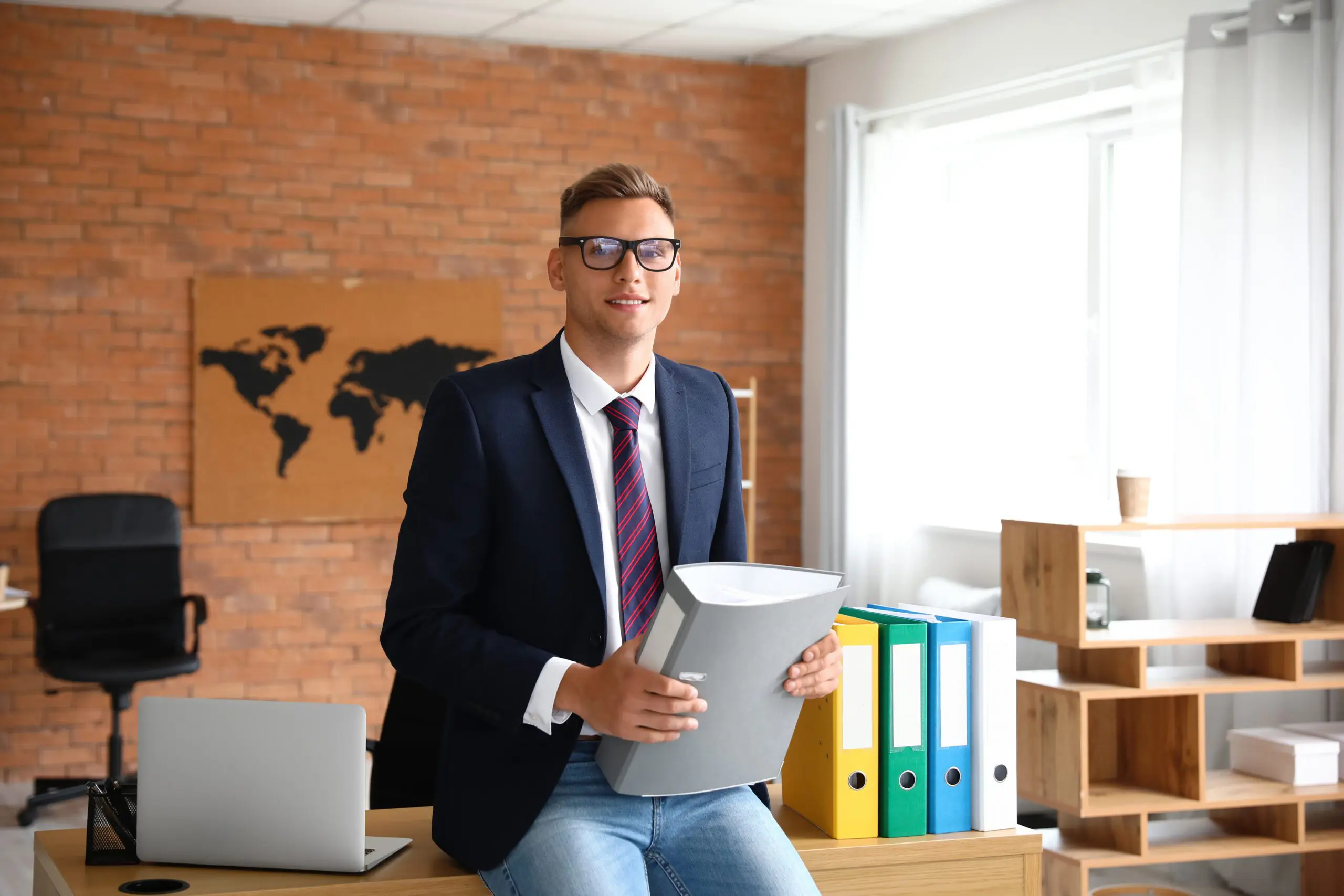 young business man holding a binder