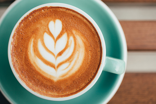 cup of hot coffee with latte art