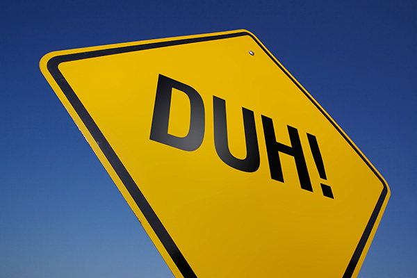 yellow road sign with "Duh!" written on it