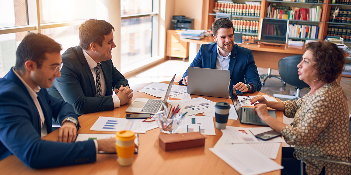 business workers collaborating around an office table