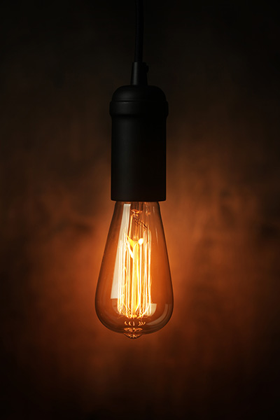 lit industrial light bulb