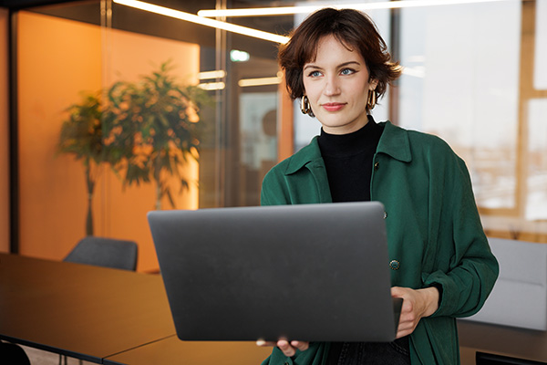 casual business woman working on laptop in conference room