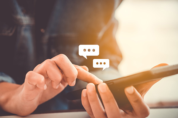 woman sending messages on smartphone