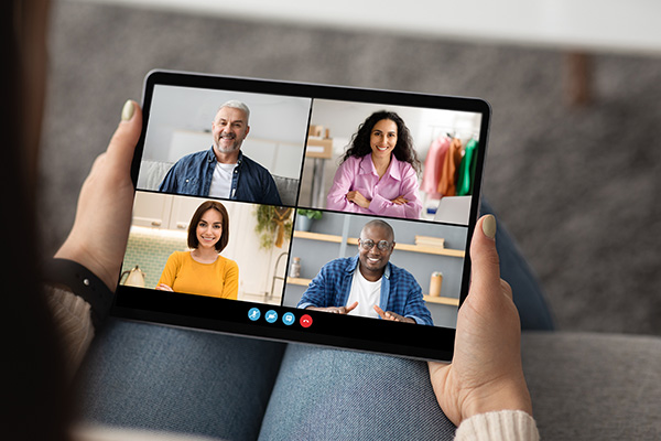 Woman taking a Zoom call on tablet device